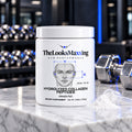 TheLooksMaxxing Grass-Fed Hydrolyzed Collagen Peptides tub on a marble plinth in a dark gym