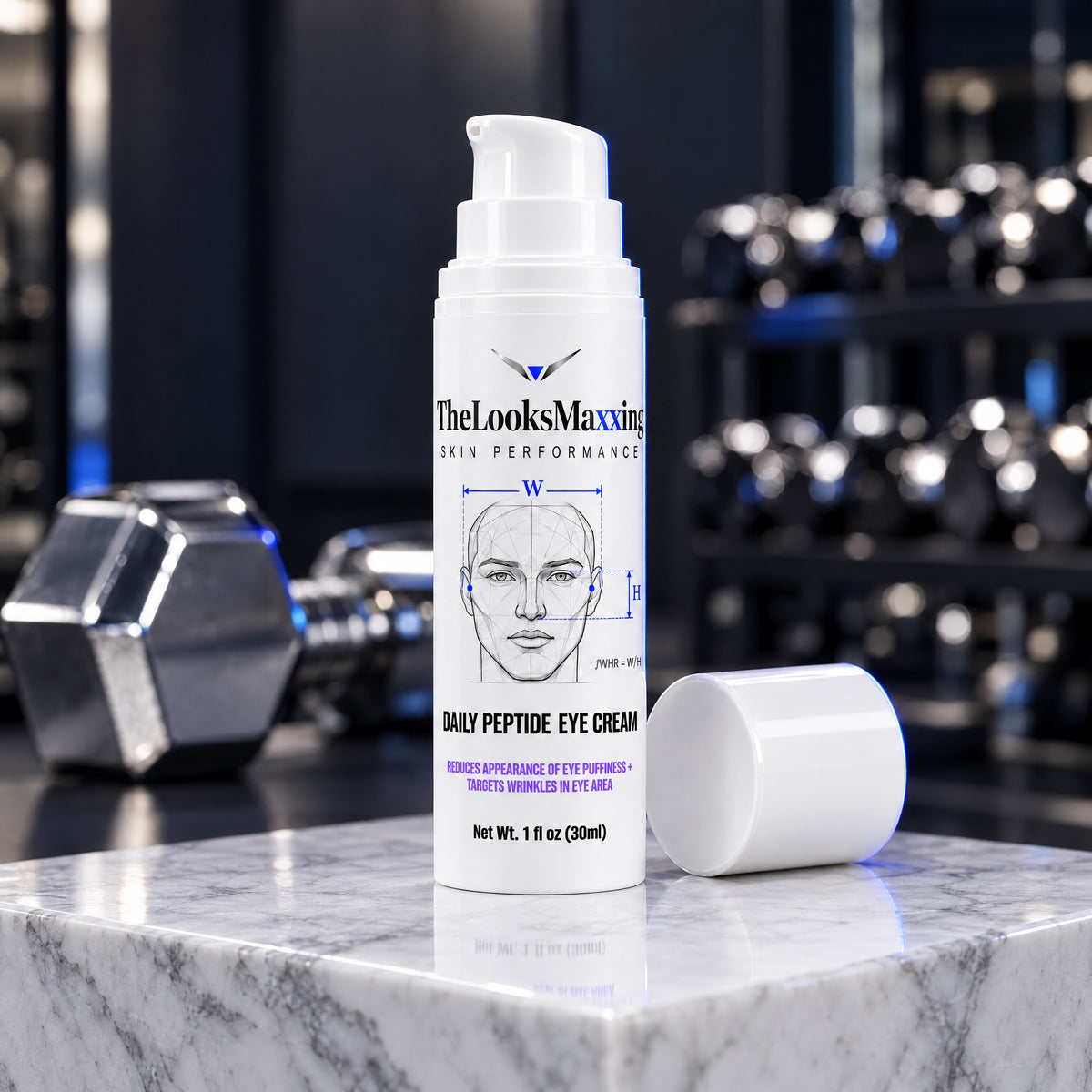 TheLooksMaxxing Daily Peptide Eye Cream pump bottle on a marble plinth in a dark gym